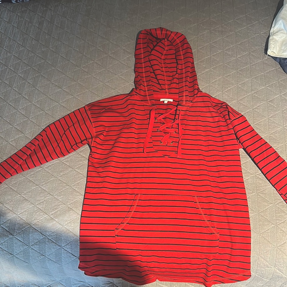 Extremely soft hoodie tunic with fun criss cross ties in front. Red and Black